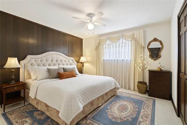 122 Belle Terre Blvd, Covington, LA 70433 - bedroom featuring wood walls and ceiling fan