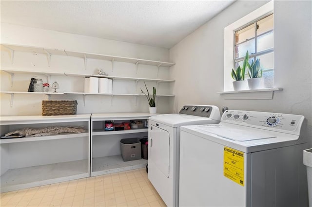 122 Belle Terre Blvd, Covington, LA 70433 - laundry room with washer and clothes dryer and a textured ceiling