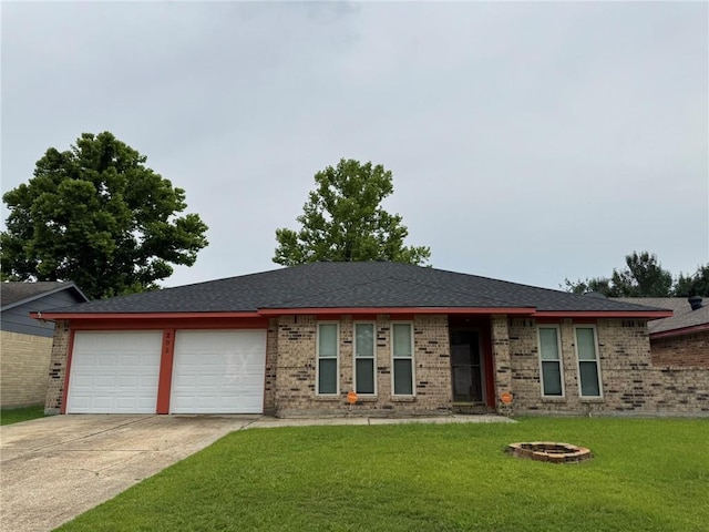 205 Hollow Rock Ct, Slidell, LA 70461 - ranch-style house featuring an attached garage, concrete driveway, a front yard, brick siding, and a fire pit