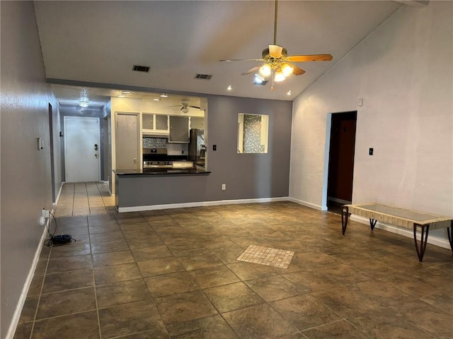 205 Hollow Rock Ct, Slidell, LA 70461 - unfurnished living room featuring ceiling fan, baseboards, and vaulted ceiling