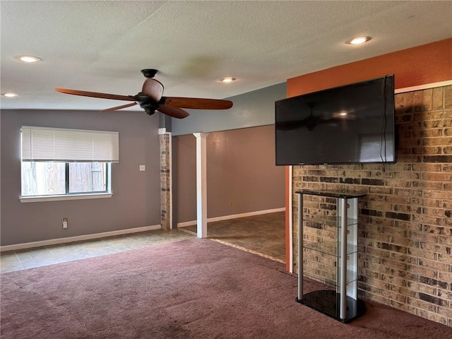 205 Hollow Rock Ct, Slidell, LA 70461 - unfurnished living room featuring carpet, ceiling fan, a textured ceiling, baseboards, and a fireplace
