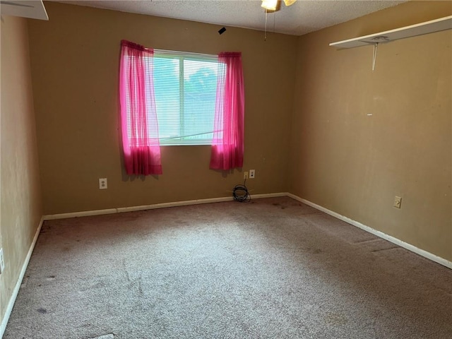 205 Hollow Rock Ct, Slidell, LA 70461 - carpeted spare room featuring a ceiling fan, a textured ceiling, and baseboards