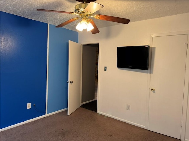 205 Hollow Rock Ct, Slidell, LA 70461 - unfurnished bedroom featuring carpet floors, a textured ceiling, a ceiling fan, and baseboards