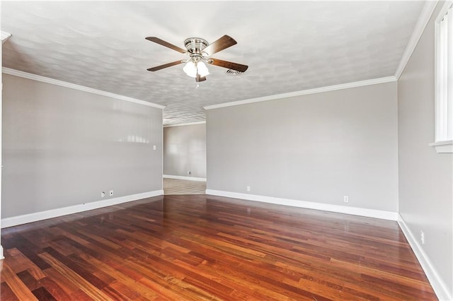 spare room with a textured ceiling, dark wood-type flooring, ornamental molding, and ceiling fan