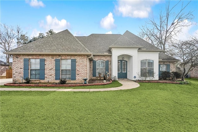 view of front of house featuring a front lawn and french doors