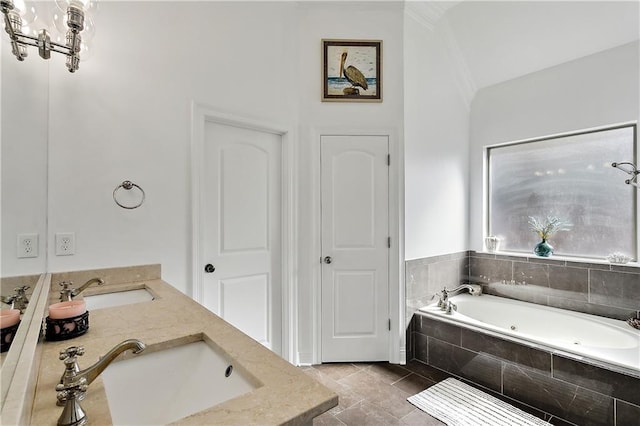 bathroom with vanity and tiled bath