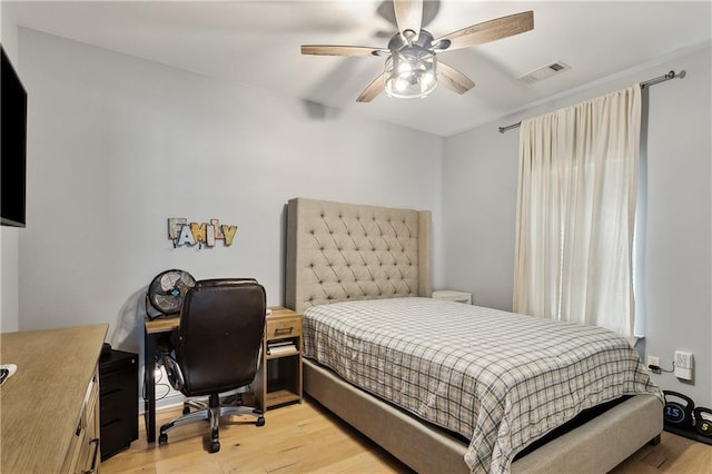 bedroom featuring light hardwood / wood-style flooring and ceiling fan