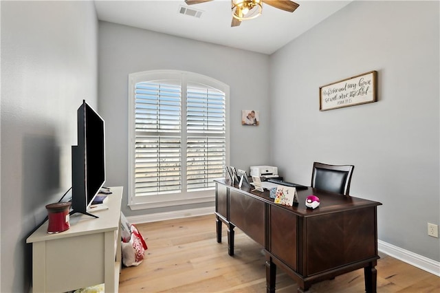 office featuring wood-type flooring and ceiling fan