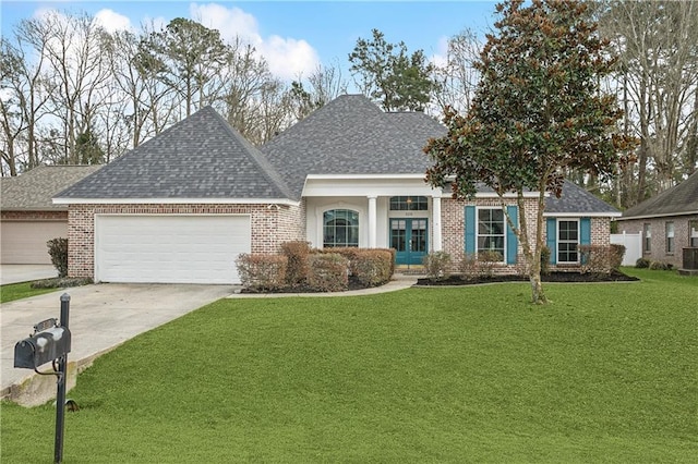 view of front of home featuring a garage, central AC, and a front lawn