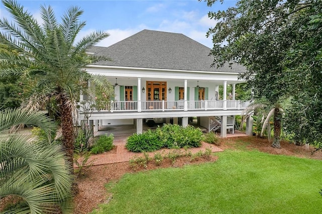 rear view of property with a yard, french doors, and covered porch