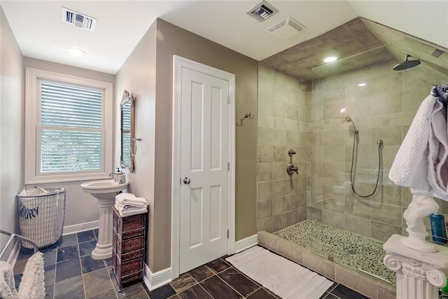 bathroom featuring tiled shower