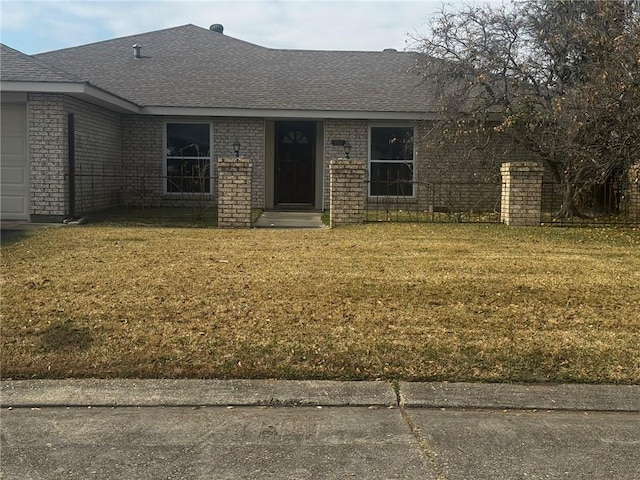 ranch-style house with a front lawn