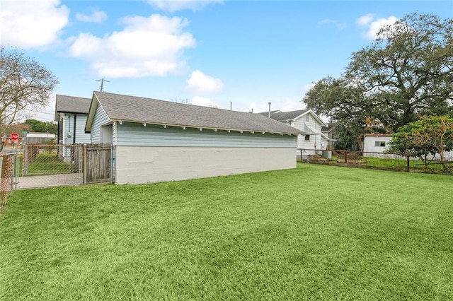 view of side of home featuring a yard