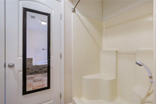 bathroom featuring a shower