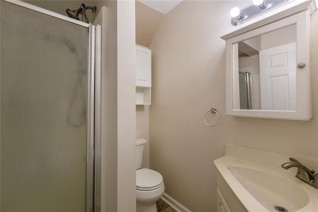 bathroom with toilet, a shower with shower door, and sink