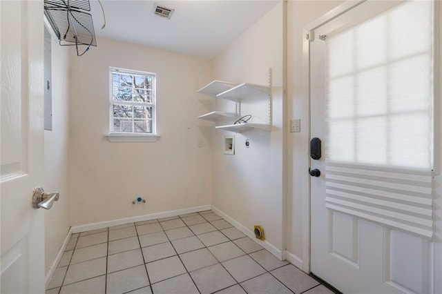 laundry area with washer hookup, hookup for a gas dryer, hookup for an electric dryer, and light tile patterned flooring