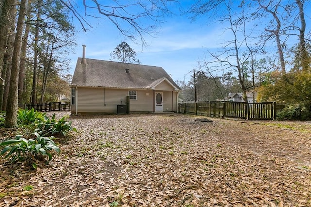 rear view of house with central air condition unit