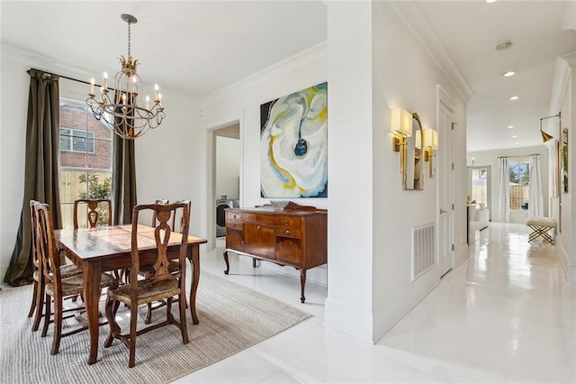 dining room featuring ornamental molding and a chandelier