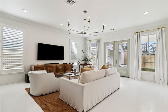 living room featuring ornamental molding and a chandelier