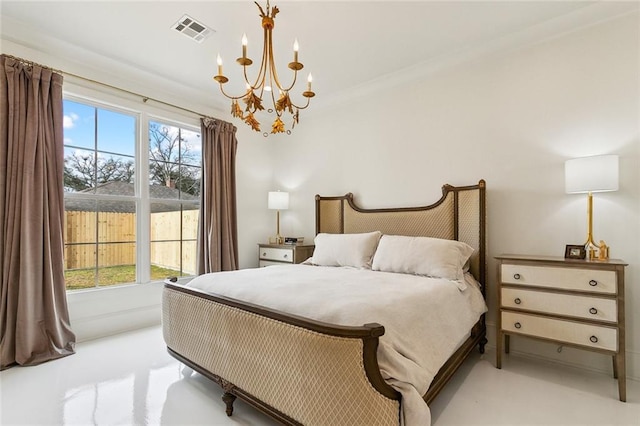 bedroom featuring multiple windows and a notable chandelier