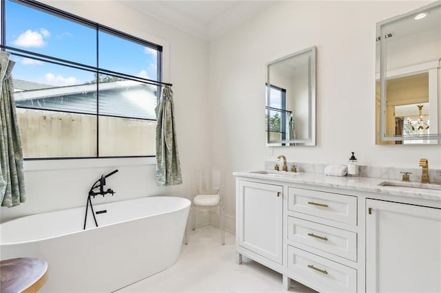 bathroom with vanity and a tub