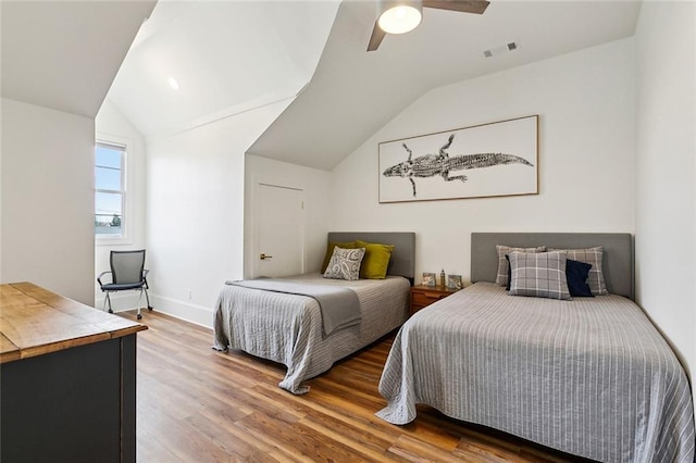 bedroom featuring wood-type flooring, lofted ceiling, and ceiling fan