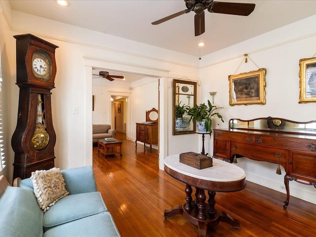 sitting room featuring recessed lighting, ceiling fan, baseboards, and wood finished floors