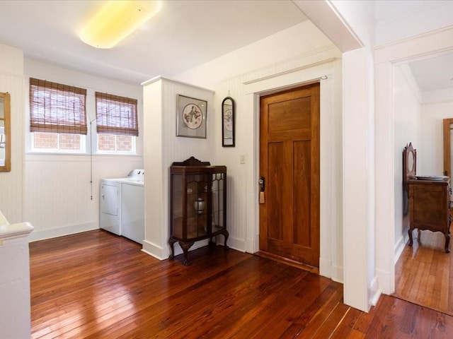 entryway featuring dark wood-style flooring and washing machine and clothes dryer