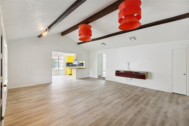 1751 Holiday Dr, New Orleans, LA 70114 - unfurnished living room with arched walkways, lofted ceiling with beams, visible vents, and light wood finished floors