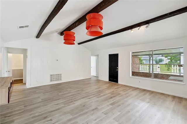 1751 Holiday Dr, New Orleans, LA 70114 - unfurnished living room with vaulted ceiling with beams, light wood-style floors, and visible vents