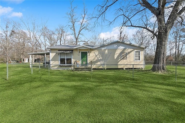 back of house with a yard