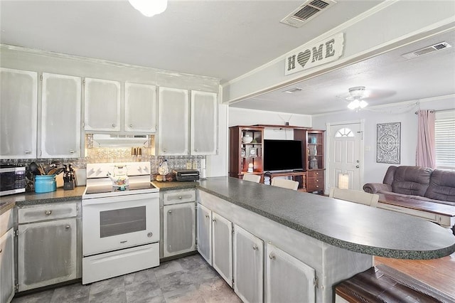 kitchen featuring white electric range oven, white cabinetry, tasteful backsplash, crown molding, and kitchen peninsula