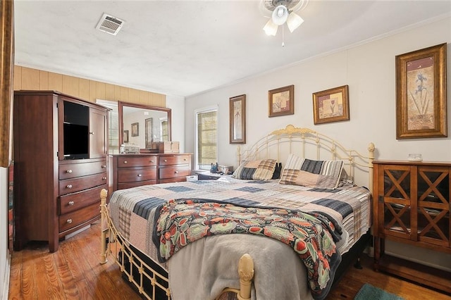 bedroom featuring crown molding and hardwood / wood-style flooring