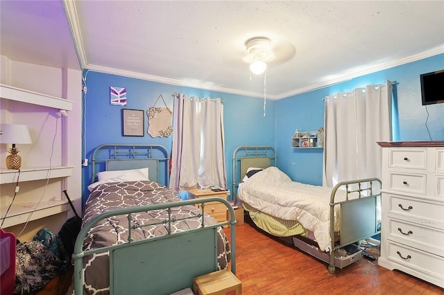 bedroom featuring dark wood-type flooring and ornamental molding