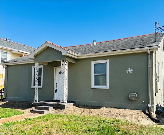 ranch-style home featuring a front yard