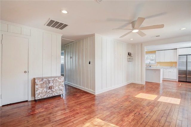 interior space featuring ceiling fan and hardwood / wood-style floors