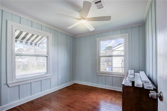 unfurnished room featuring ornamental molding, dark hardwood / wood-style floors, and ceiling fan