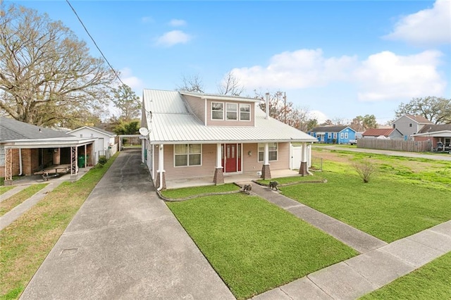 bungalow-style home featuring a porch, a carport, and a front yard