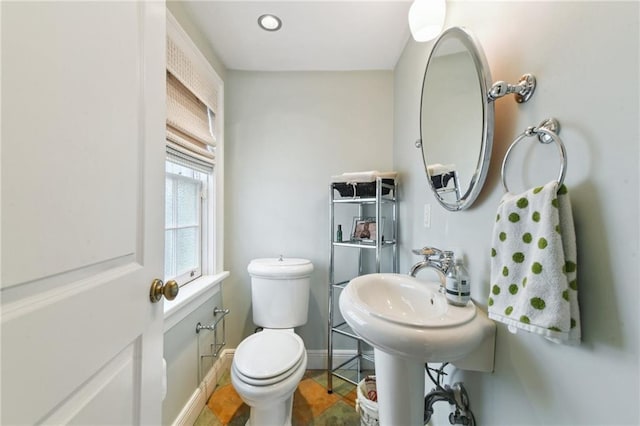 bathroom featuring tile patterned flooring and toilet