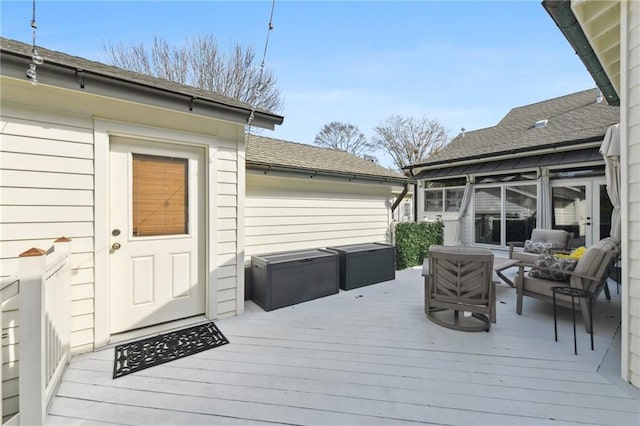 wooden deck featuring an outdoor hangout area