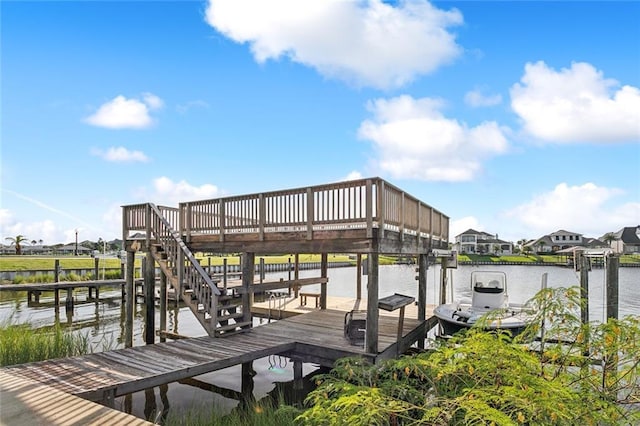 dock area featuring boat lift and a water view