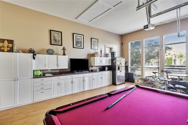 recreation room with billiards and light wood-style floors