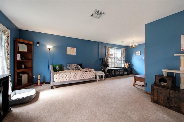 bedroom with carpet floors and a chandelier