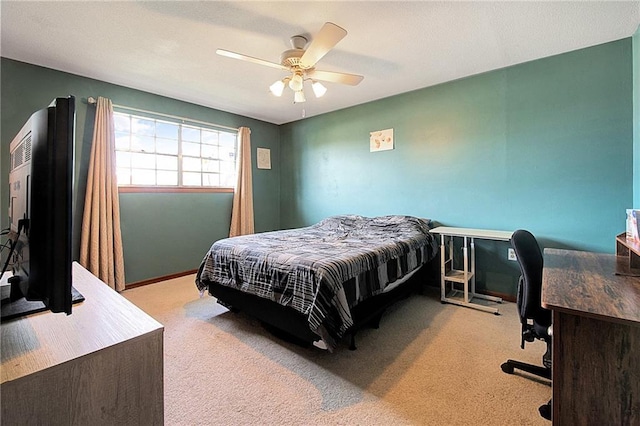 bedroom featuring ceiling fan and light colored carpet