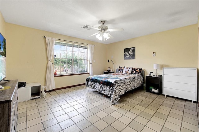 bedroom featuring light tile patterned flooring and ceiling fan