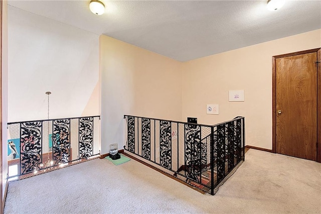 hallway featuring carpet flooring