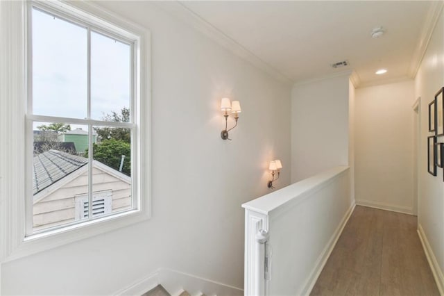 hall featuring hardwood / wood-style flooring and ornamental molding