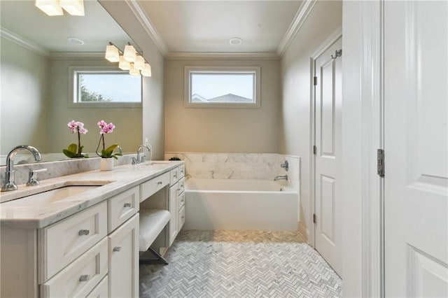 bathroom featuring crown molding, vanity, a bathtub, and plenty of natural light