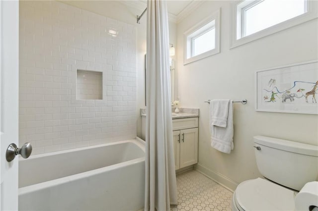 full bathroom featuring vanity, tiled shower / bath, crown molding, and toilet