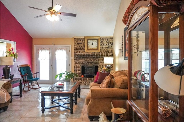 tiled living room with vaulted ceiling, french doors, and ceiling fan